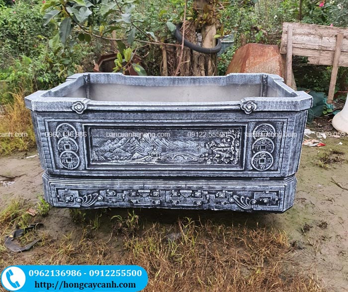 bể cá cảnh xi măng hình vuông với hoa văn đồng tiền
